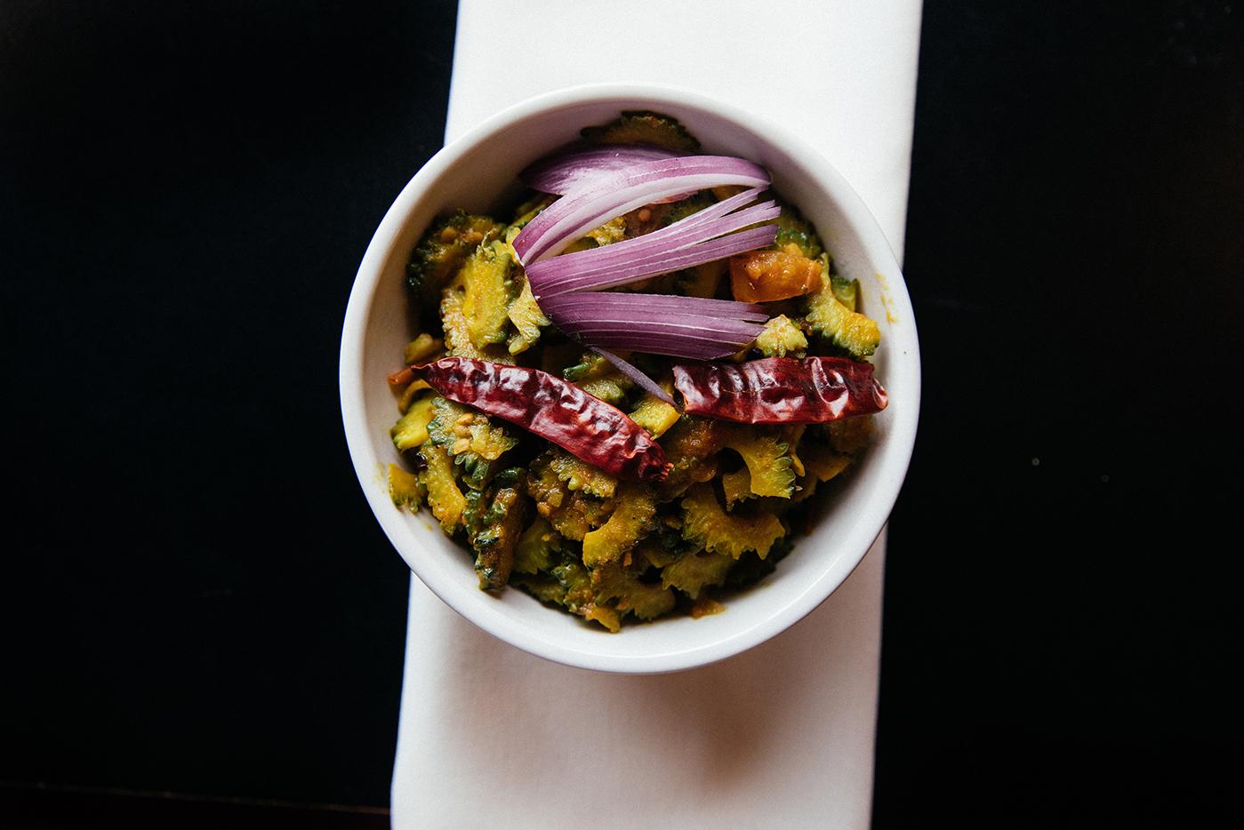 Karela, bitter gourd in a spiced tomato sauce, from Himalayan Sherpa Kitchen. Photo: Sandy Noto for WTTW