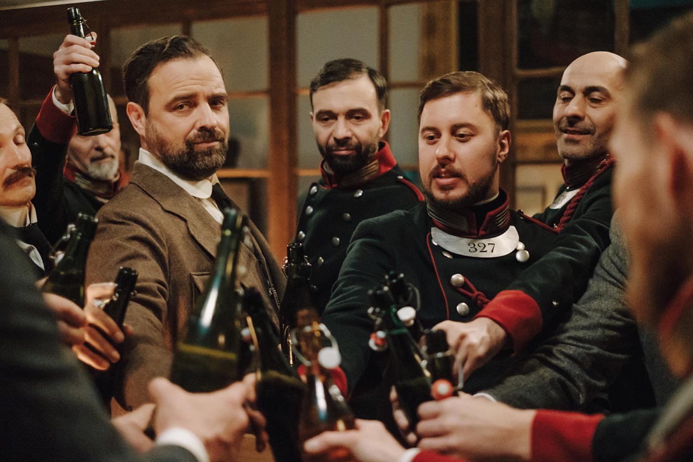 Oskar is celebrated at the police station in Vienna Blood. Photo: Petro Domenigg/2019 Endor Productions/MR Film