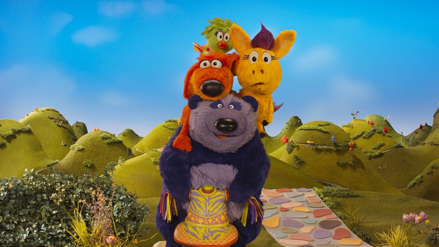 Purple Panda, Bob Dog, Duck Duck, and Donkey Hodie on a scooter