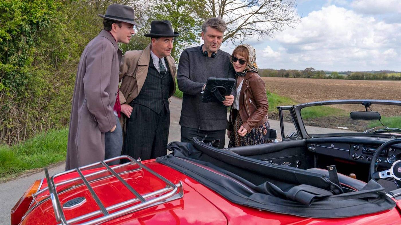 Matthew Beard as James Fraser, Timothy McMullan as Atticus Pünd, director Peter Cattaneo, and Lesley Manville as Susan Ryeland on the set of 'Magpie Murders.' Photo: Nick Wall