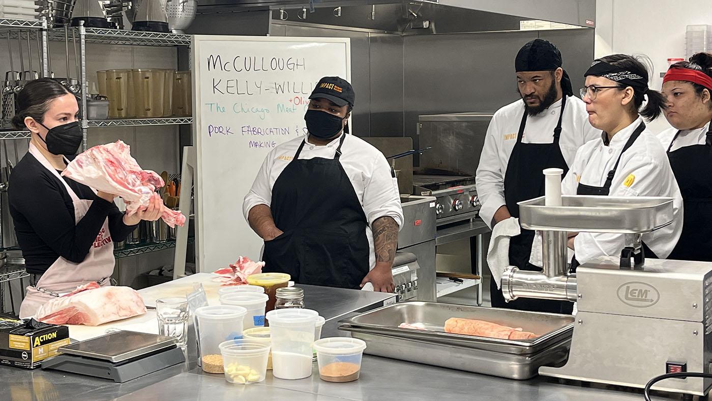 Students taking a butchery class at Impact Culinary Training