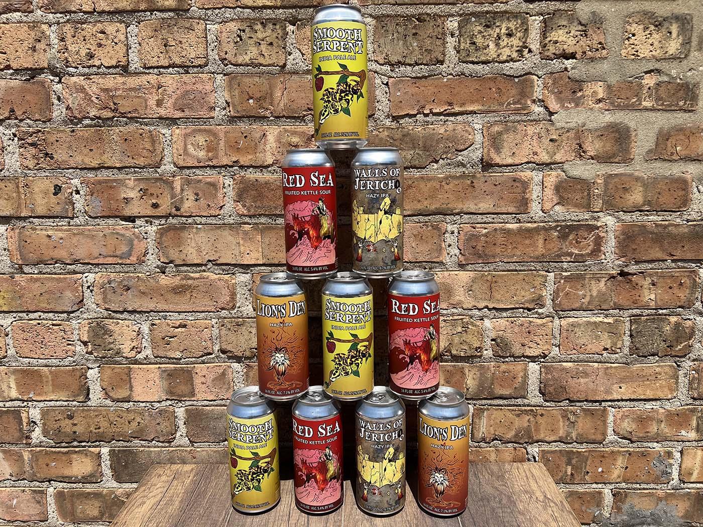 Beer cans stacked in a pyramid 