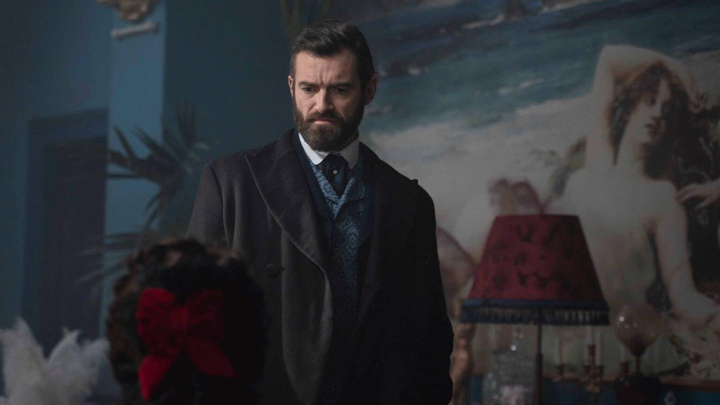 William looks seriously at a woman