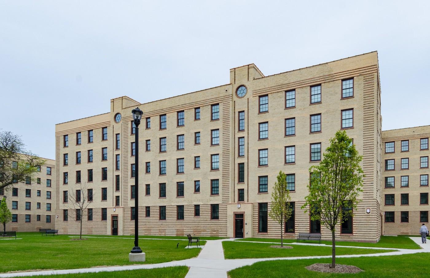 The Art Deco exterior of the Rosenwald Court apartments in Chicago, with a green lawn in front