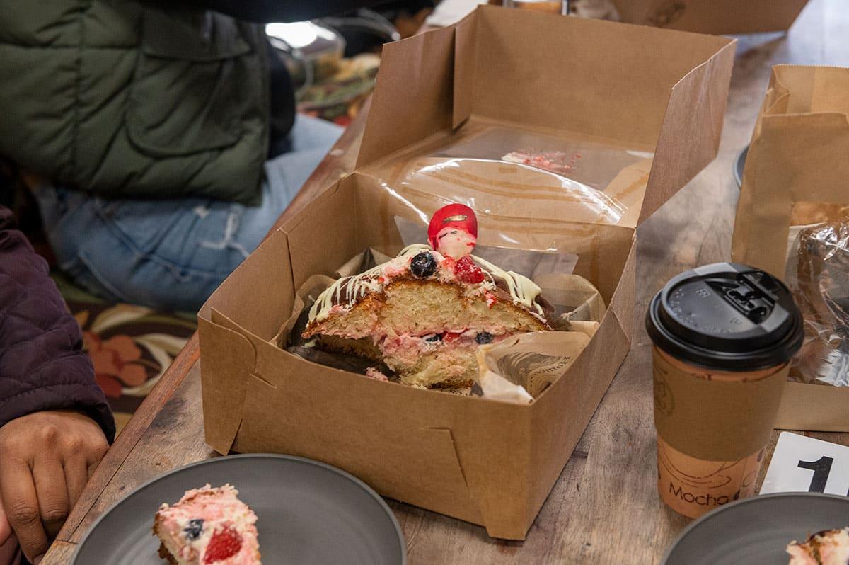 An open box with half of a pan de muerto