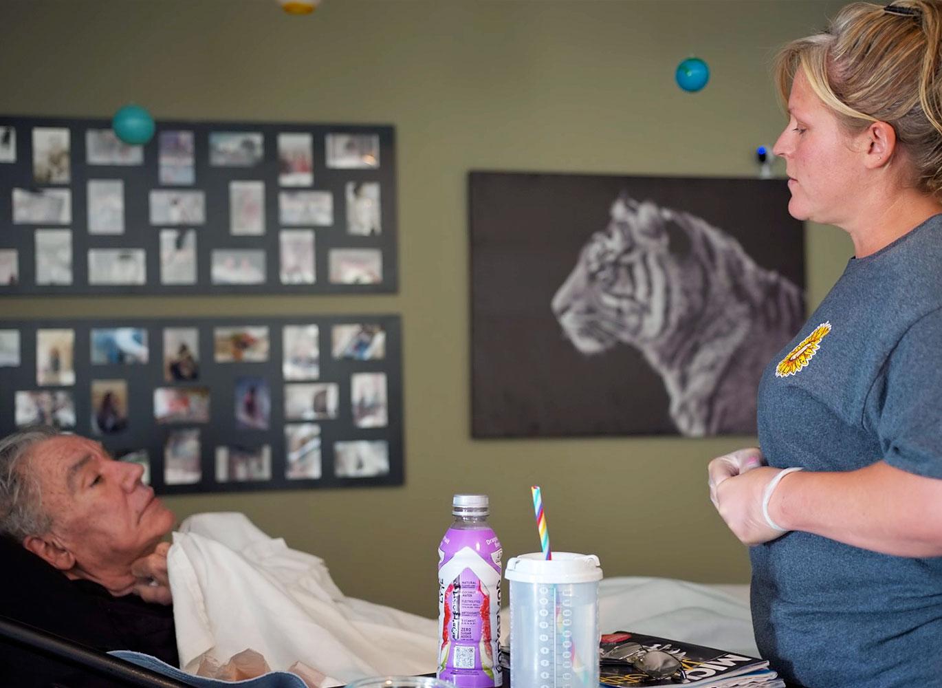 Tracy Eacret with her father, John, to whom she is providing end-of-life care at her Colorado home. Tracy Eacret with her father, John, to whom she is providing end-of-life care at her Colorado home.