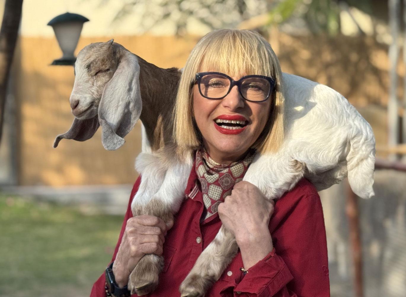 Maria and a goat. Maria and a goat.