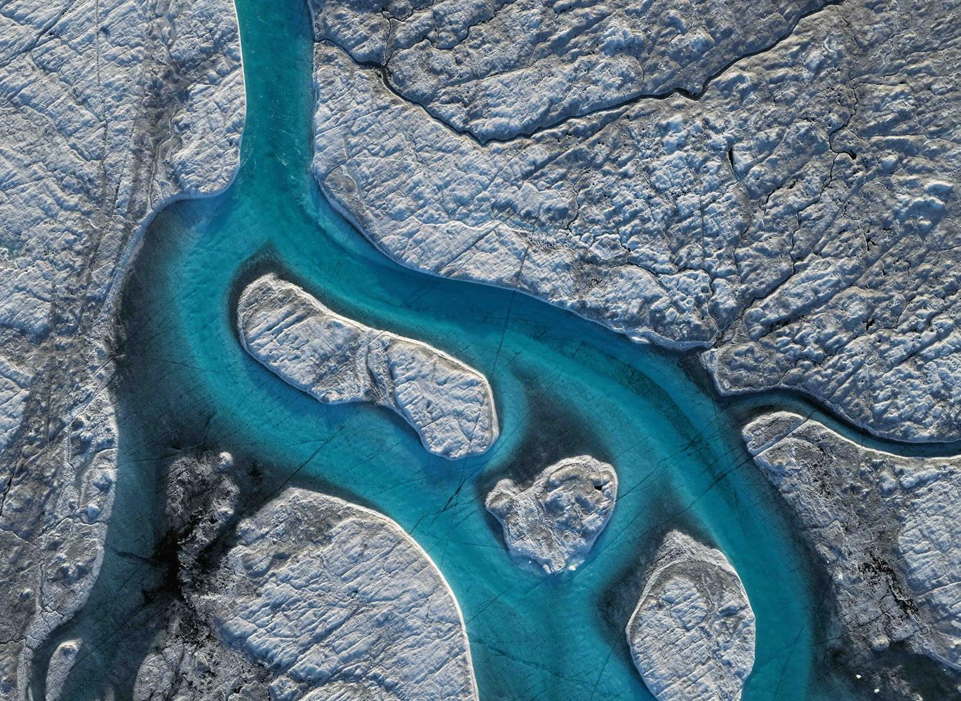 Greenland ice sheet aerial of moulin