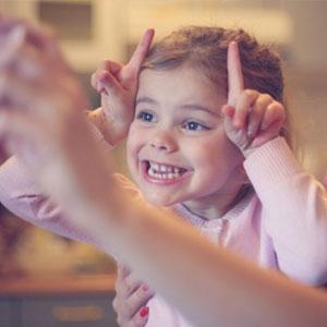 Child making silly faces.