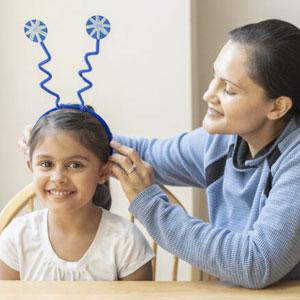 Child with snowflake headband