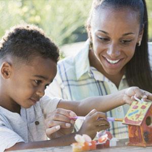 Mother and son doing crafts.