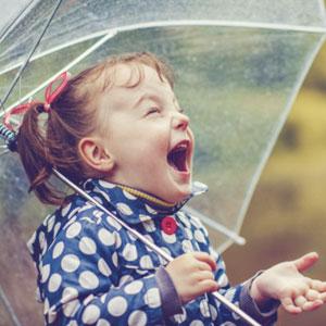 Little girl with umbrella.
