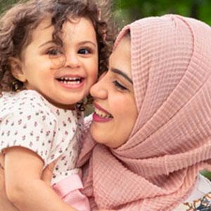 Mother and child hugging.
