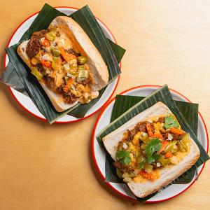 Sandwiches on plates on banana leaves