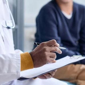 Doctor taking notes.
