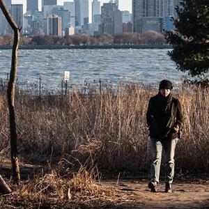 Person walking at Montrose Point Bird Sanctuary.