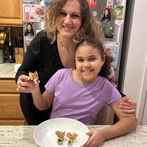Child and mom in the kitchen.