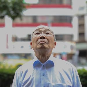 A man looks up outside