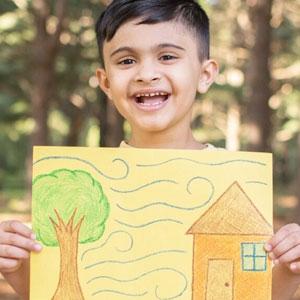 Child presenting weather drawing