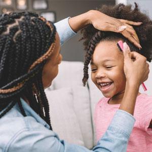 Mom helping child with hair