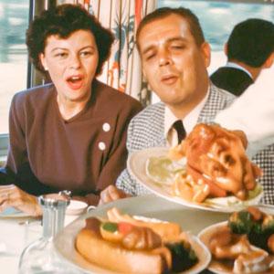 A couple enjoying the dining car.