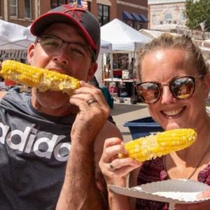 People enjoying corn on the cob