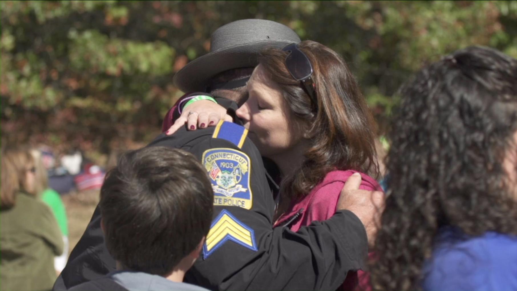 Nicole Hockley, mother of Sandy Hook victim, and first responder Sgt. Bill Cario. (Courtesy of Derek Weisehahn)