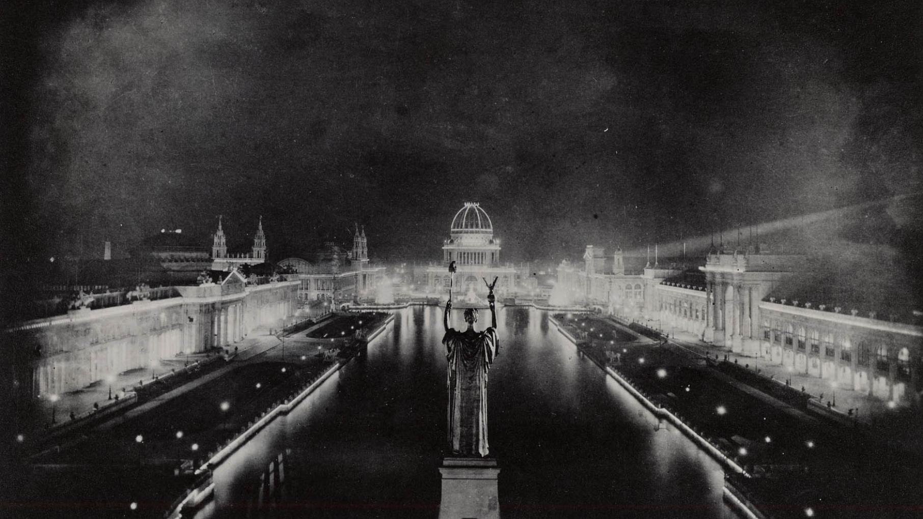 The Statue of the Republic looks over the "white city" of the 1893 Chicago World's Fair, with its electric lights. The World's Columbian Exposition of 1893 in Chicago