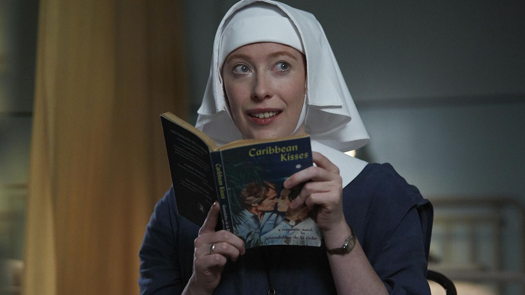 Both Sister Winifred and Sister Monica Joan find themselves enthralled by a steamy romance novel suggested by Monica Joan's unlikely new friend. Photo: Neal Street Productions Sister Winifred in Call the Midwife. Photo: Neal Street Productions