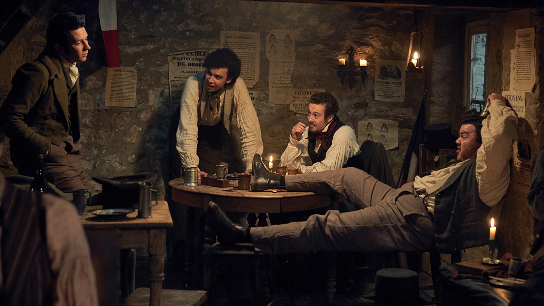 Colonel Pontmercy's son Marius revolts against his grandfather's politics when he learns more about his father. Photo: Robert Viglasky / Lookout Point Marius (Josh O'Connor) and Republicans in Les Miserables. Photo: Robert Viglasky / Lookout Point