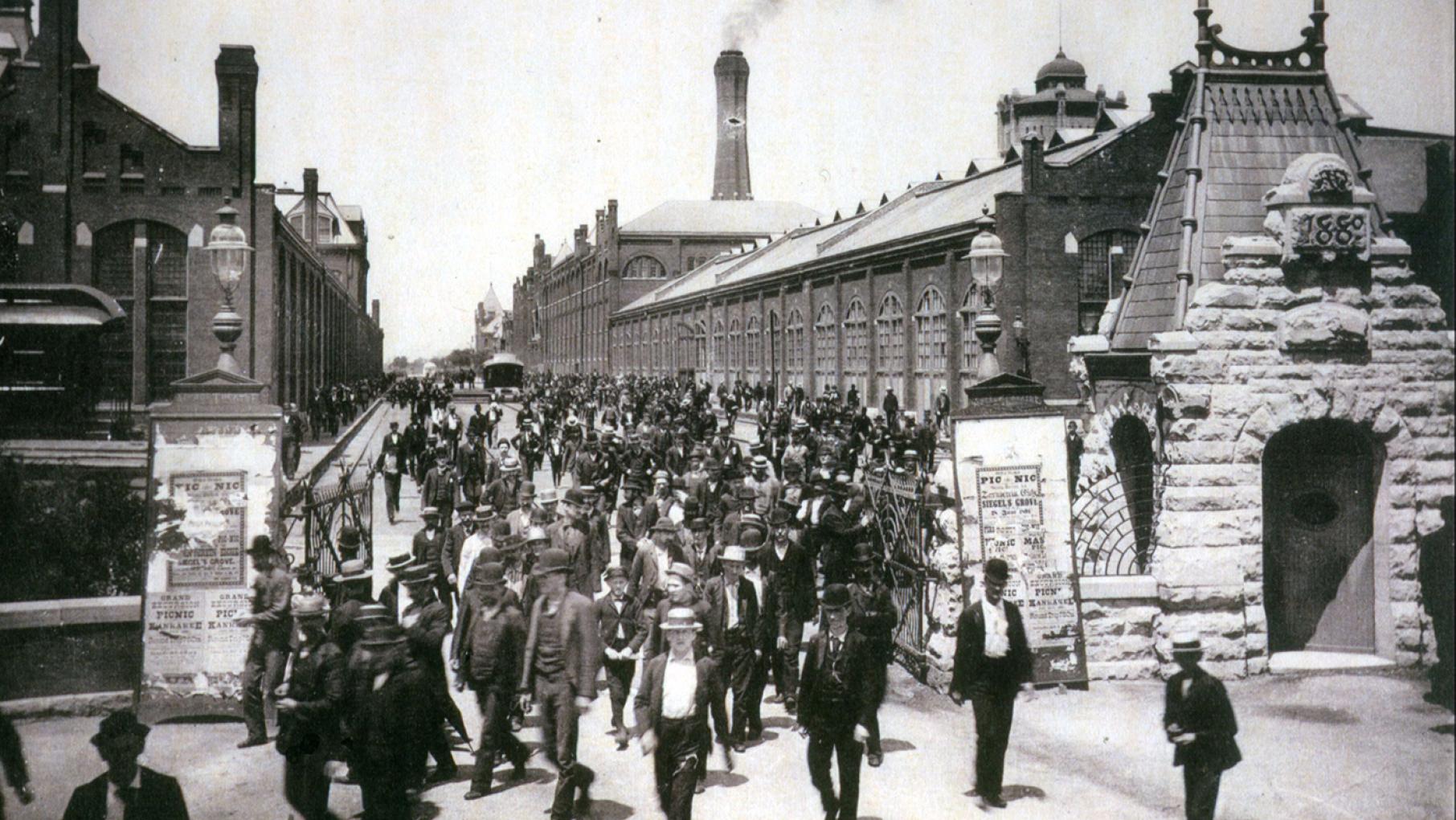 Workers leave the Pullman Palace Car Works, 1893. This picture appeared in a promotional booklet celebrating the labor policies of George Pullman. Photo: Wikimedia Commons Workers leave the Pullman Palace Car Works, 1893. This picture appeared in a promotional booklet celebrating the labor policies of George Pullman.