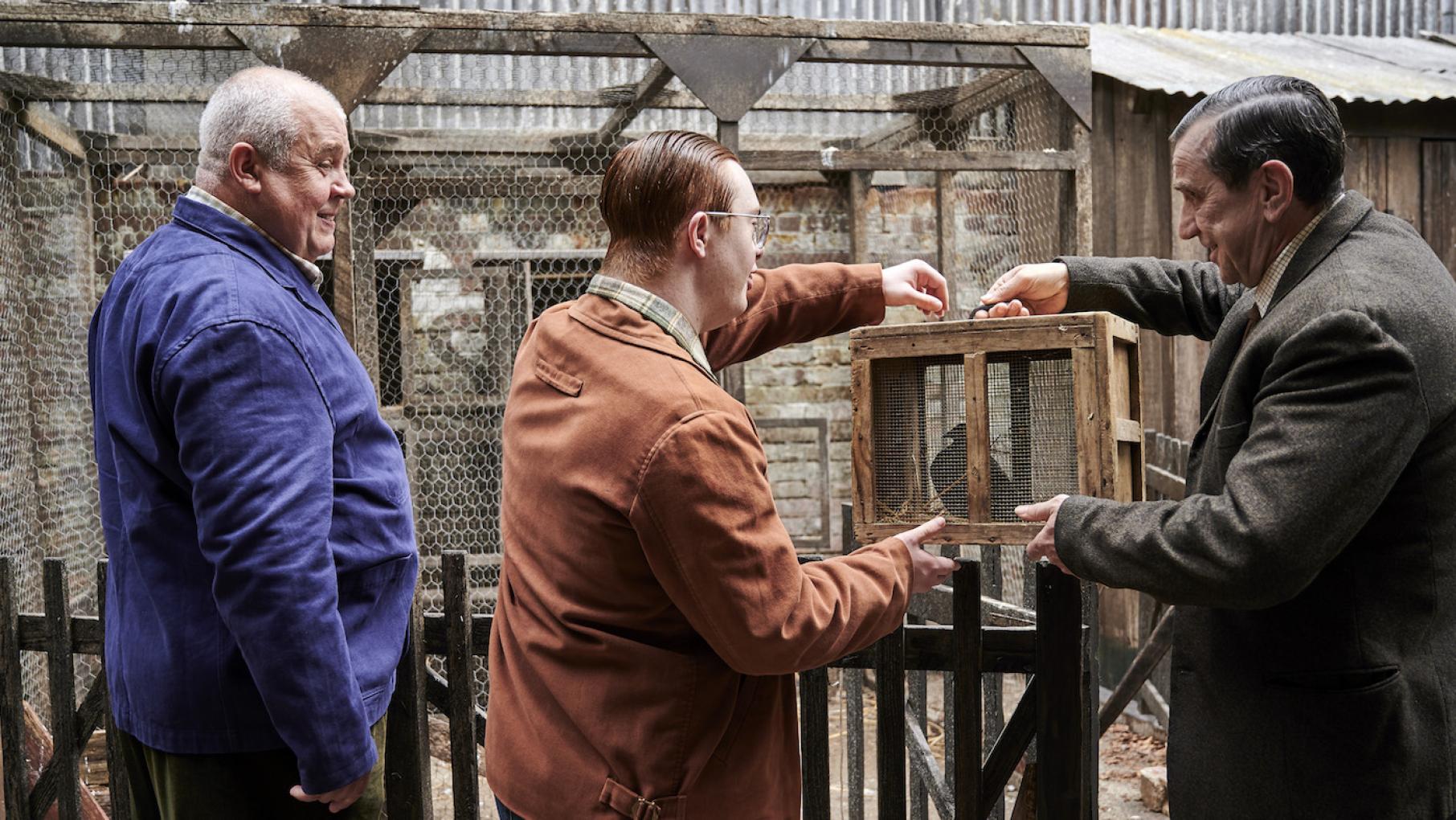 Fred and Reggie meet a man who keeps pigeons and lives in a condemned building. Photo: BBC / Neal Street Productions Fred, Reggie, and George Benson in 'Call the Midwife.' Photo: BBC / Neal Street Productions