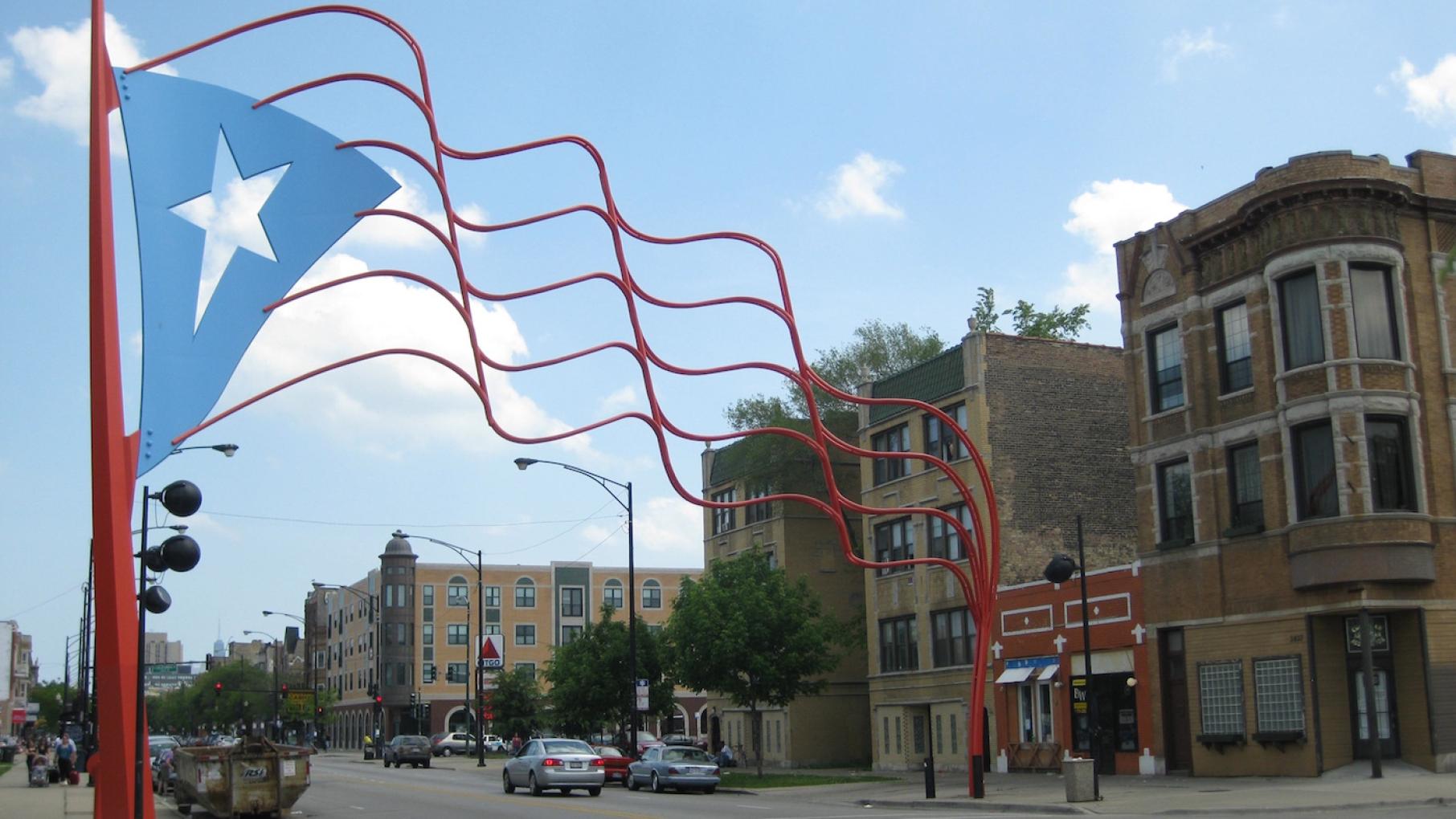 Two steel flags mark Humboldt Park's "Paseo Boricua," a heart of the Puerto Rican community along Division Street. Photo: Richie Diesterheft/Wikimedia Commons The steel Puerto Rican flag over Division Street in Humboldt Park. Photo: Richie Diesterheft/Wikimedia Commons