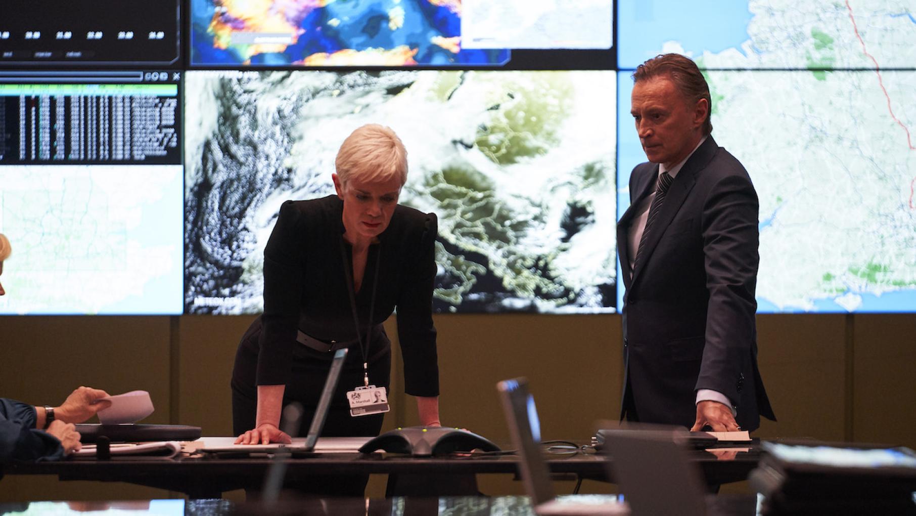 As a solar storm threatens Earth with mass blackouts, the British Prime Minister and his chief of staff handle a fractious Cabinet Anna Marshall and Robert Sutherland in 'COBRA.'