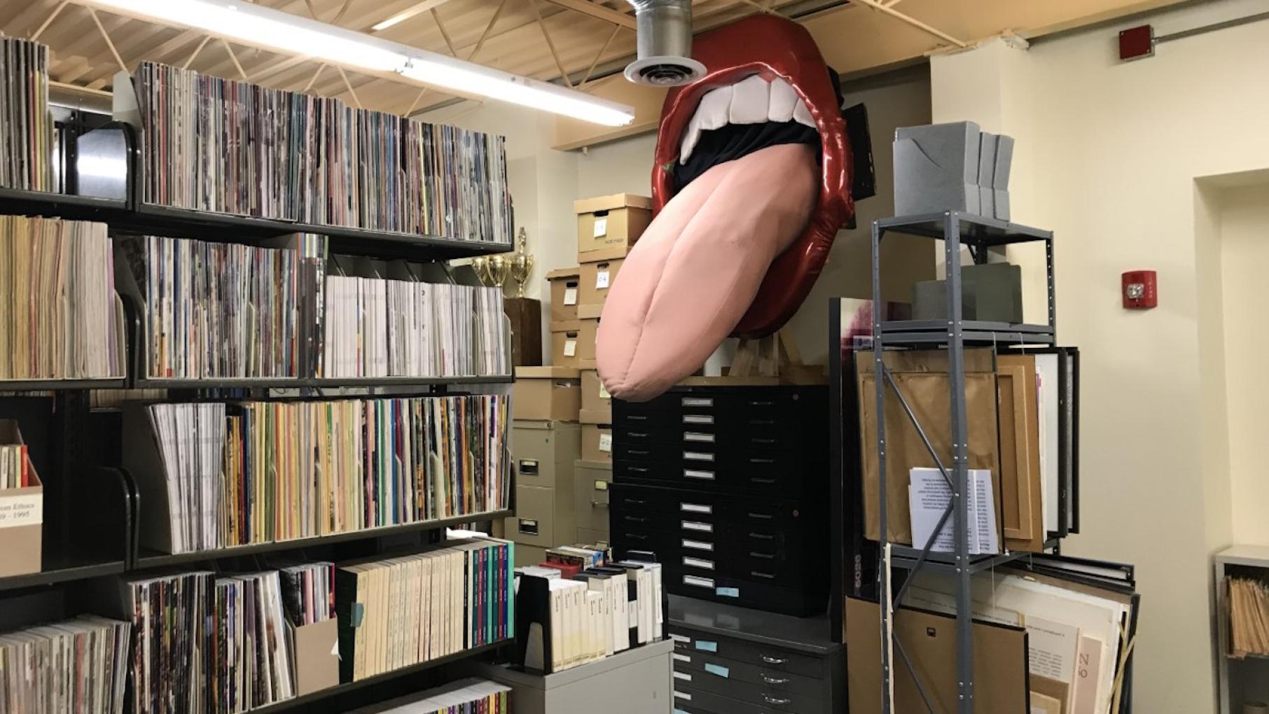A mouth with its tongue sticking out that used to hang in Carol's Speakeasy and now resides in the Gerber/Hart Library and Archives
