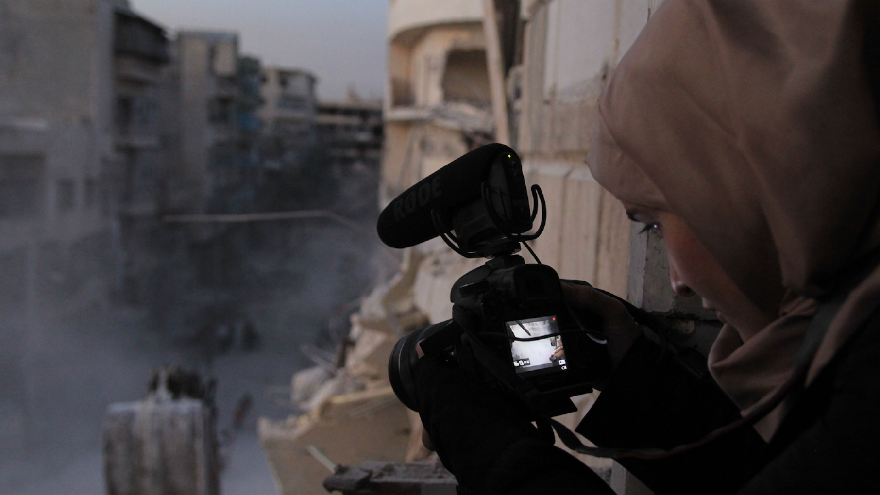 Waad al-Kateab filming the ruins of a building destroyed by bombing in besieged east Aleppo in October 2016 in 'For Sama.' Photo: Waad al-Kateab/FRONTLINE Waad al-Kateab filming the ruins of a building destroyed by bombing in besieged east Aleppo in October 2016. Photo: Waad al-Kateab/FRONTLINE