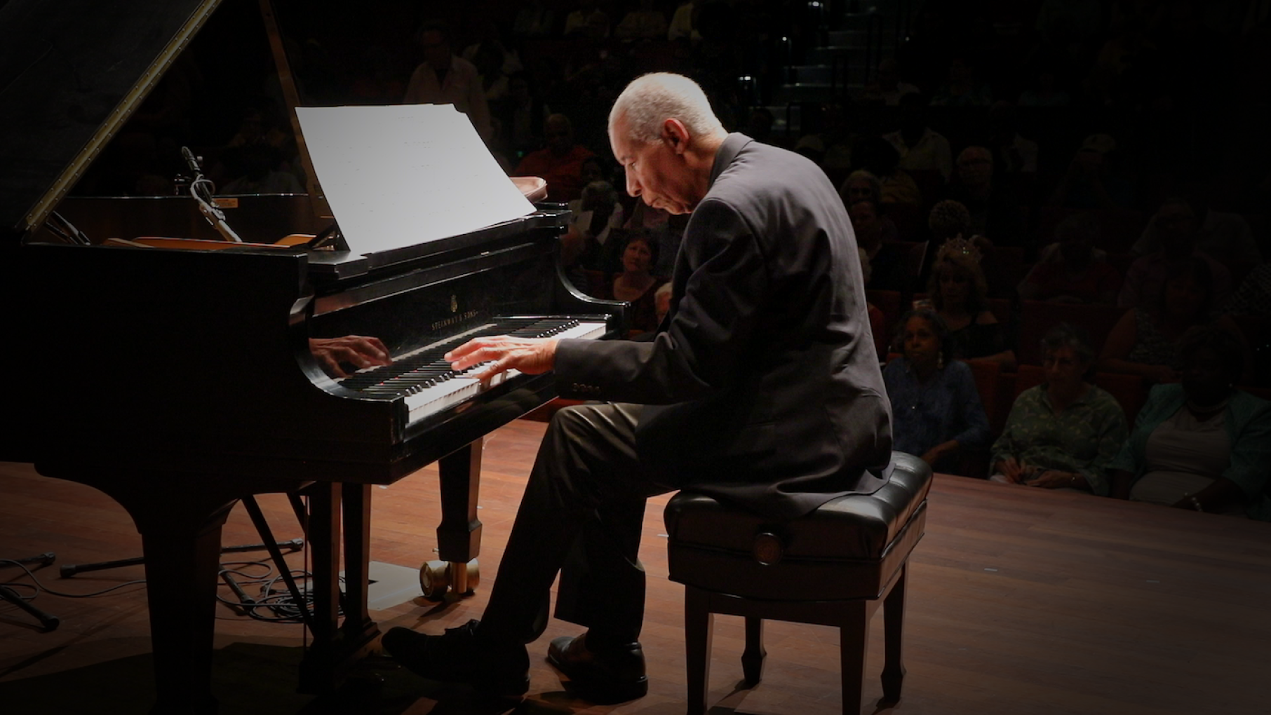 “The beating heart of this film is who Norman is: that beautiful face of his, his experiences, his warmth," says the film's writer and co-producer Howard Reich Norman Malone at the piano