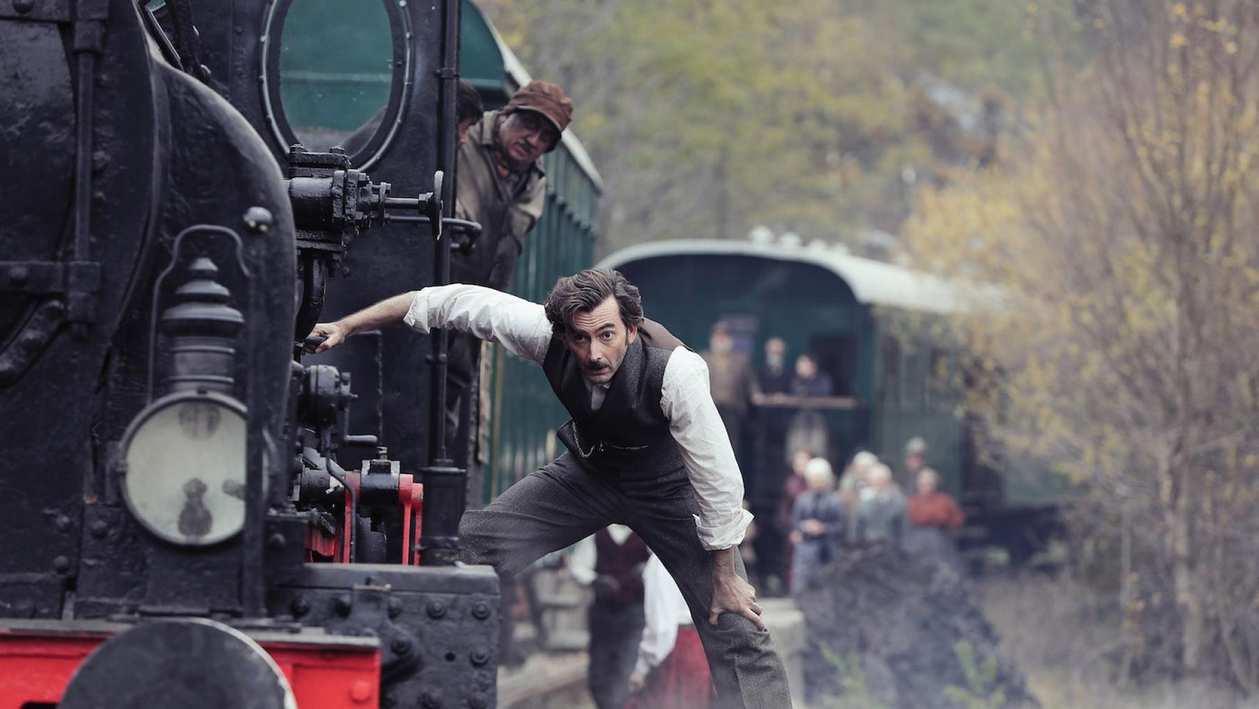 To save a life while on a train through Italy, Fogg comes up with a dangerous plan. Photo: Tudor Cucu - © Slim 80 Days / Federation Entertainment / Peu Communications / ZDF / Be-Films / RTBF Phileas Fogg on a train through Italy in ' Around the World in 80 Days.' Photo: Tudor Cucu - © Slim 80 Days / Federation Entertainment / Peu Communications / ZDF / Be-Films / RTBF