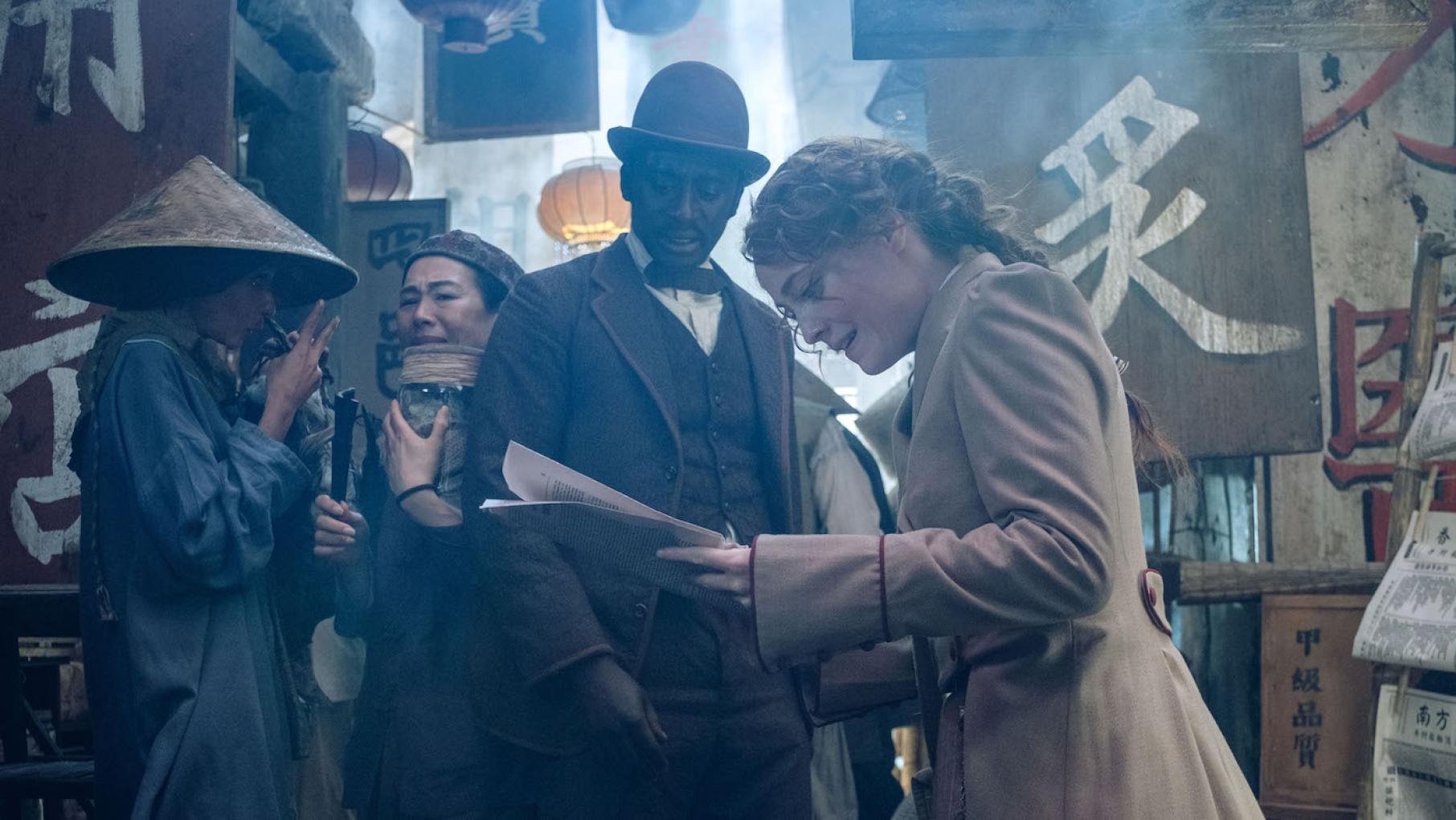 Passepartout tries to find money in Hong Kong to allow Fogg to continue his journey. Photo: Graham Bartholomew - © Slim 80 Days / Federation Entertainment / Peu Communications / ZDF / Be-Films / RTBF (télévision belge) Passepartout and Fix in Around the World in 80 Days. Photo: Graham Bartholomew - © Slim 80 Days / Federation Entertainment / Peu Communications / ZDF / Be-Films / RTBF (télévision belge)