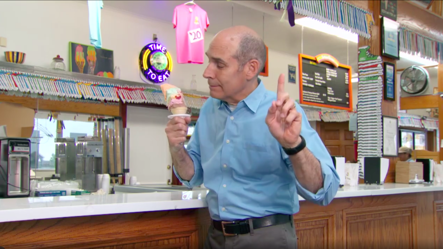 Don't interrupt someone while they're enjoying a Rainbow Cone! Image: From Chicago's South Side Geoffrey Baer eating a rainbow cone