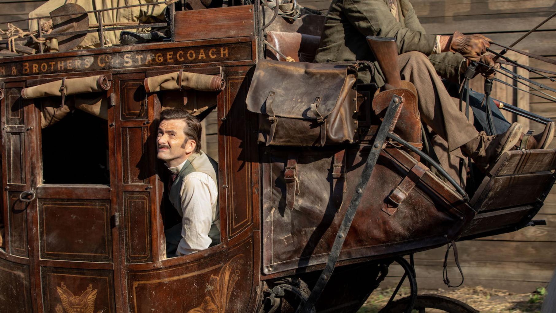 Phileas Fogg is in the Wild West. Photo: Tudor Cucu - © Slim 80 Days / Federation Entertainment / Peu Communications / ZDF / Be-Films / RTBF (télévision belge) Phileas Fogg in a stagecoach in Around the World in 80 Days. Photo: Tudor Cucu - © Slim 80 Days / Federation Entertainment / Peu Communications / ZDF / Be-Films / RTBF (télévision belge)
