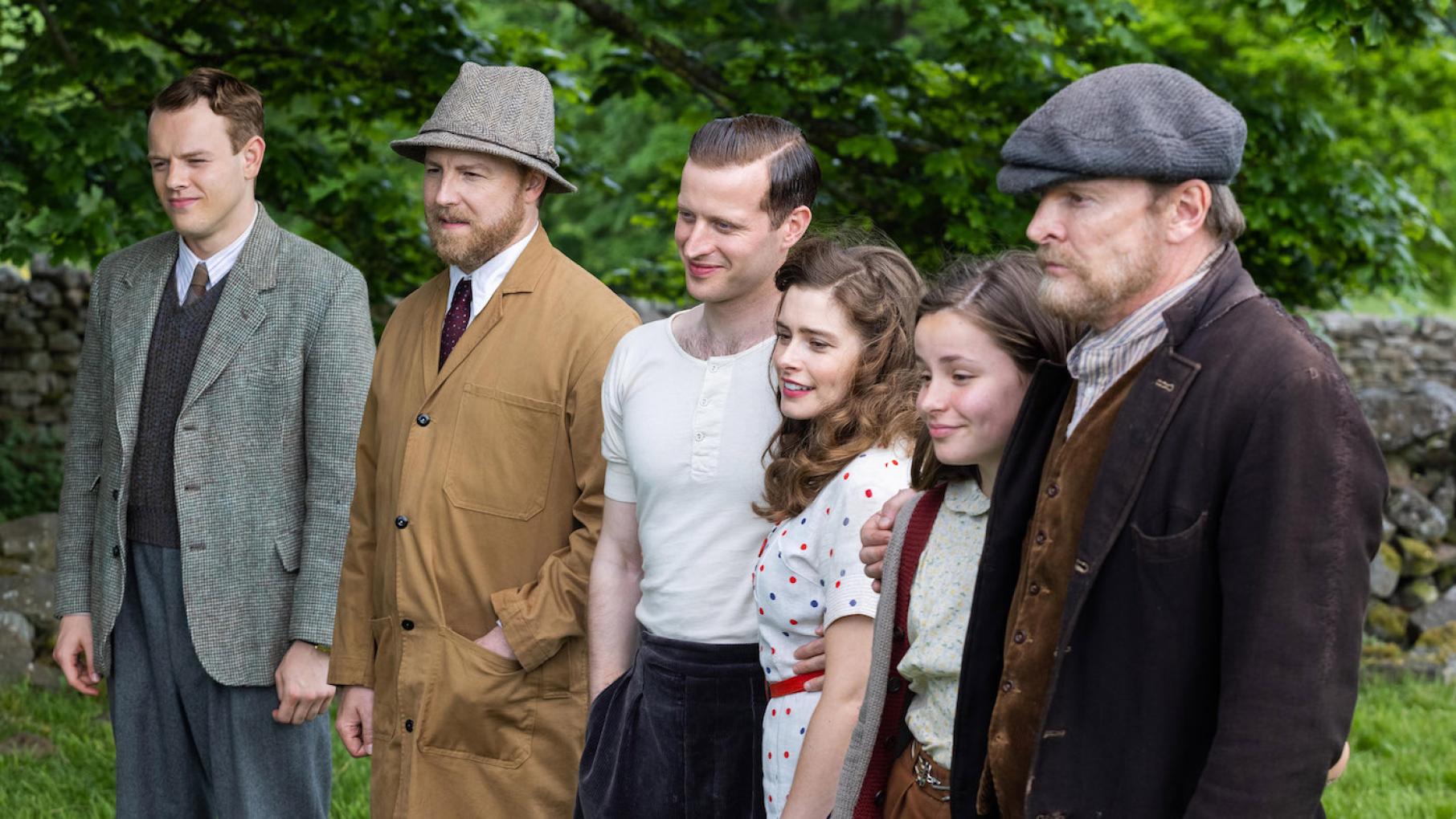 All the vets and the Aldersons get to share a touching moment. Photo: Playground Television (UK) Ltd. Tristan, Siegfried, James, Helen, Jenny and her father in All Creatures Great and Small. Photo: Playground Television (UK) Ltd.