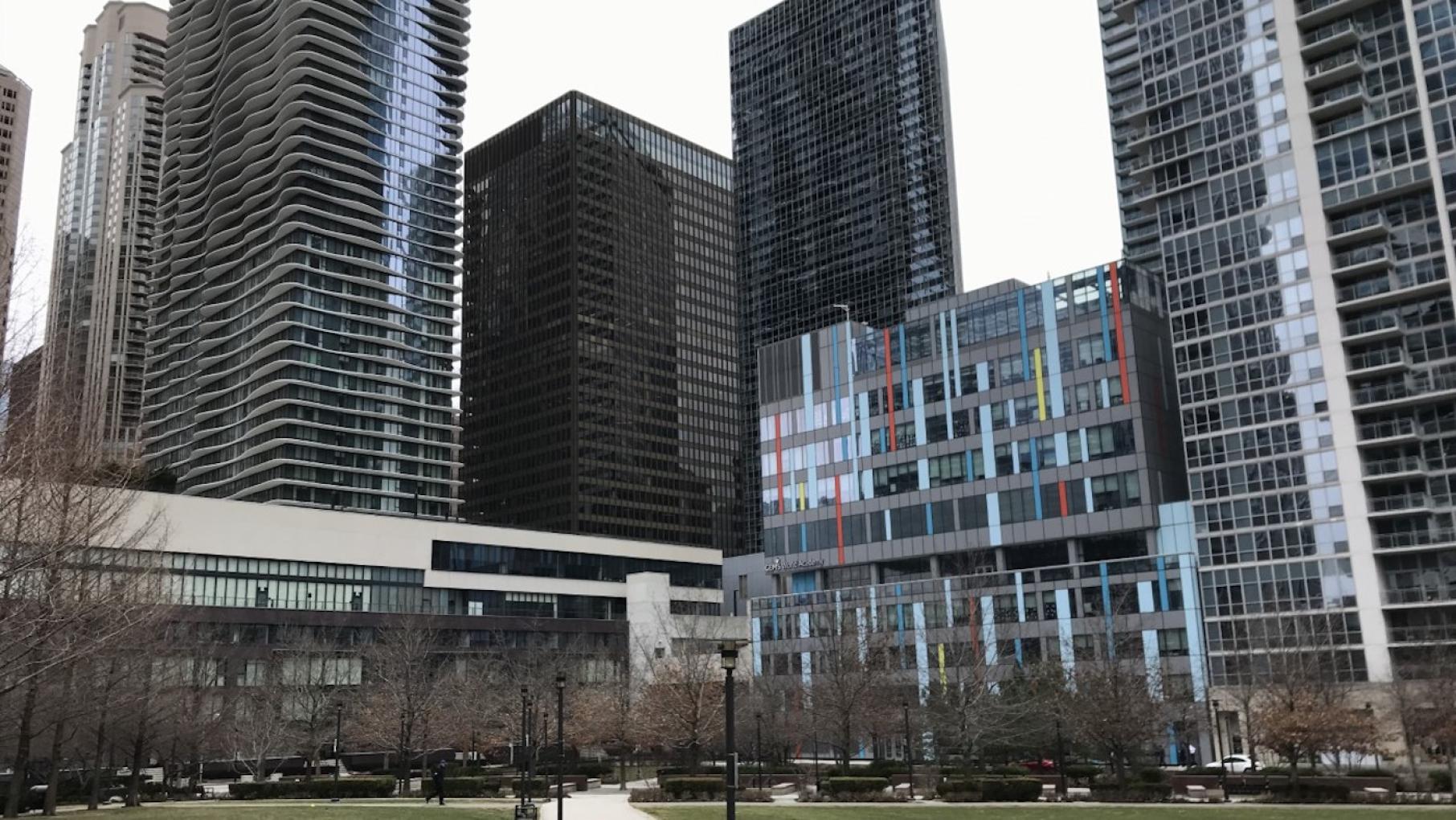 The colorful GEMS World Academy, designed by Danielle Tillman of bKl Architecture, sits adjacent to Jeanne Gang's Aqua in Lakeshore East Park. Photo: WTTW GEMS World Academy and Aqua from Lakeshore East Park in Chicago. Photo: WTTW