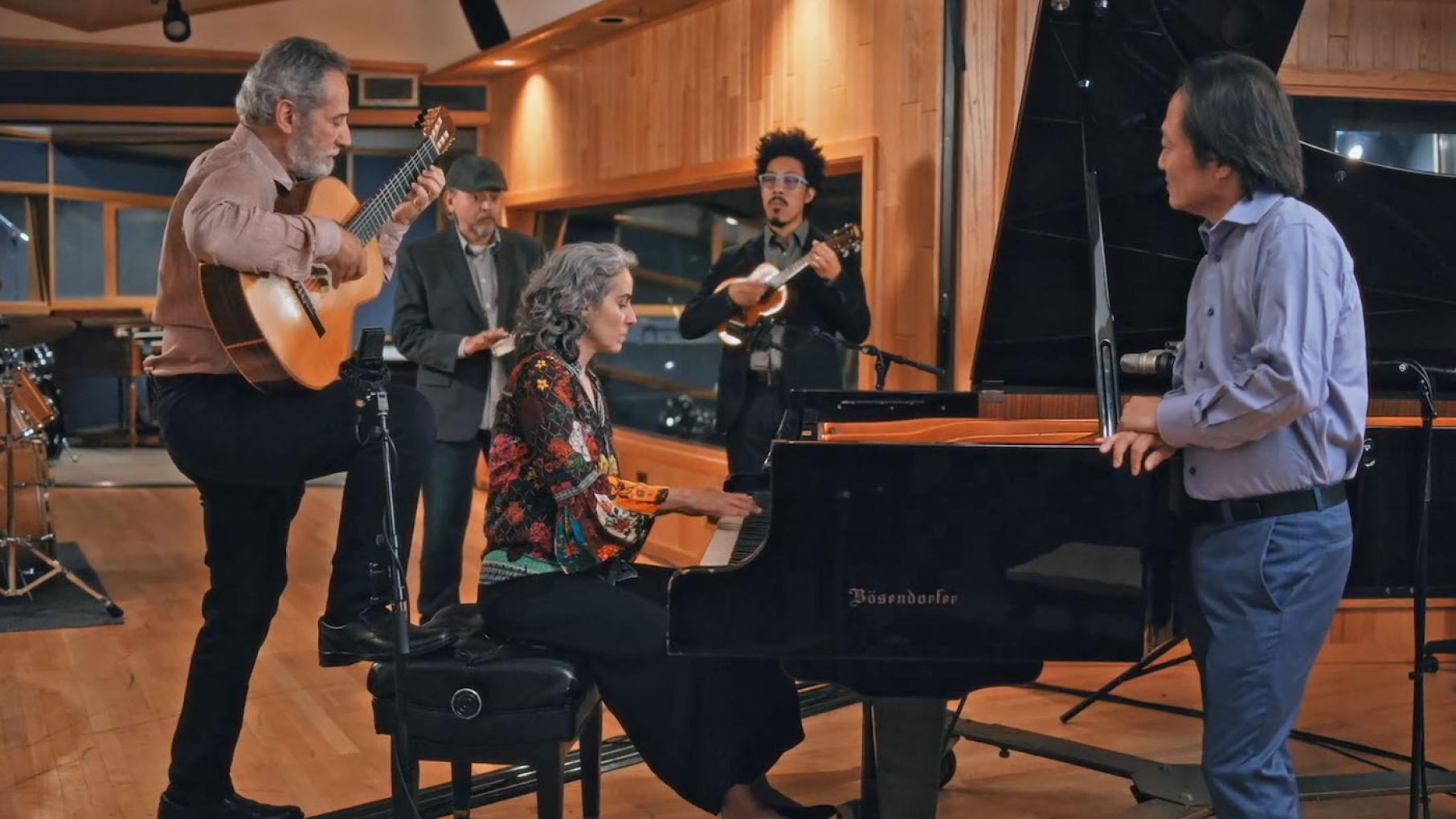 Scott Yoo learns about the Brazilian roots of the Chicago-based composer and guitarist Sergio Assad's music in a new season of 'Now Hear This.' Photo: Arcos Film and Music Sergio Assad with daughter Clarice Assad and musicians with Scott Yoo. Photo: Arcos Film and Music