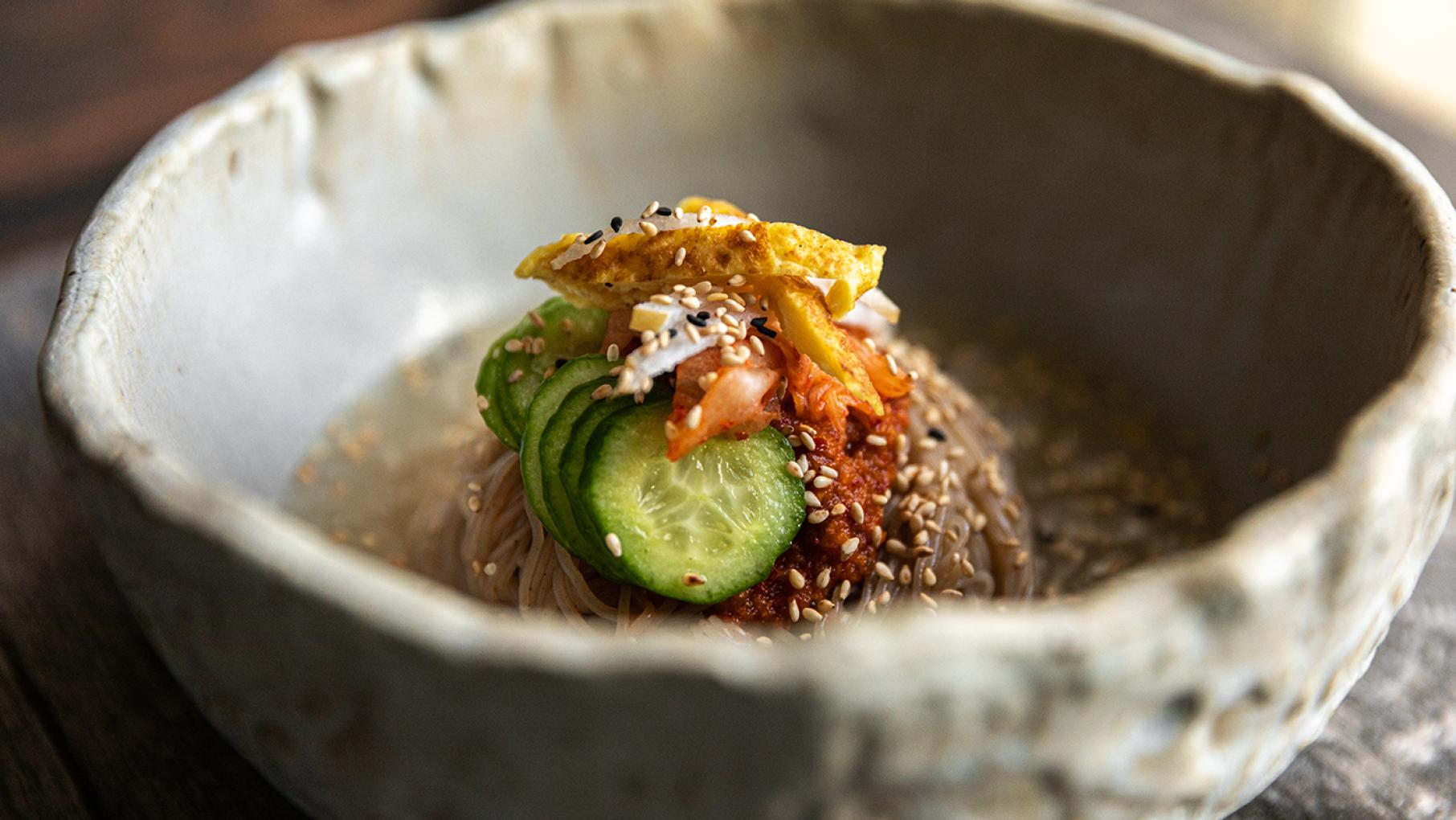 Joanne Lee Molinaro says her naengmyeon recipe is good for a hot day, or day when you're feeling down. Image: Courtesy of "The Korean Vegan," by Joanne Lee Molinaro Naengmyeon, or cold buckwheat noodles, from "The Korean Vegan" cookbook. Image Courtesy of "The Korean Vegan" by Joanne Lee Molinaro