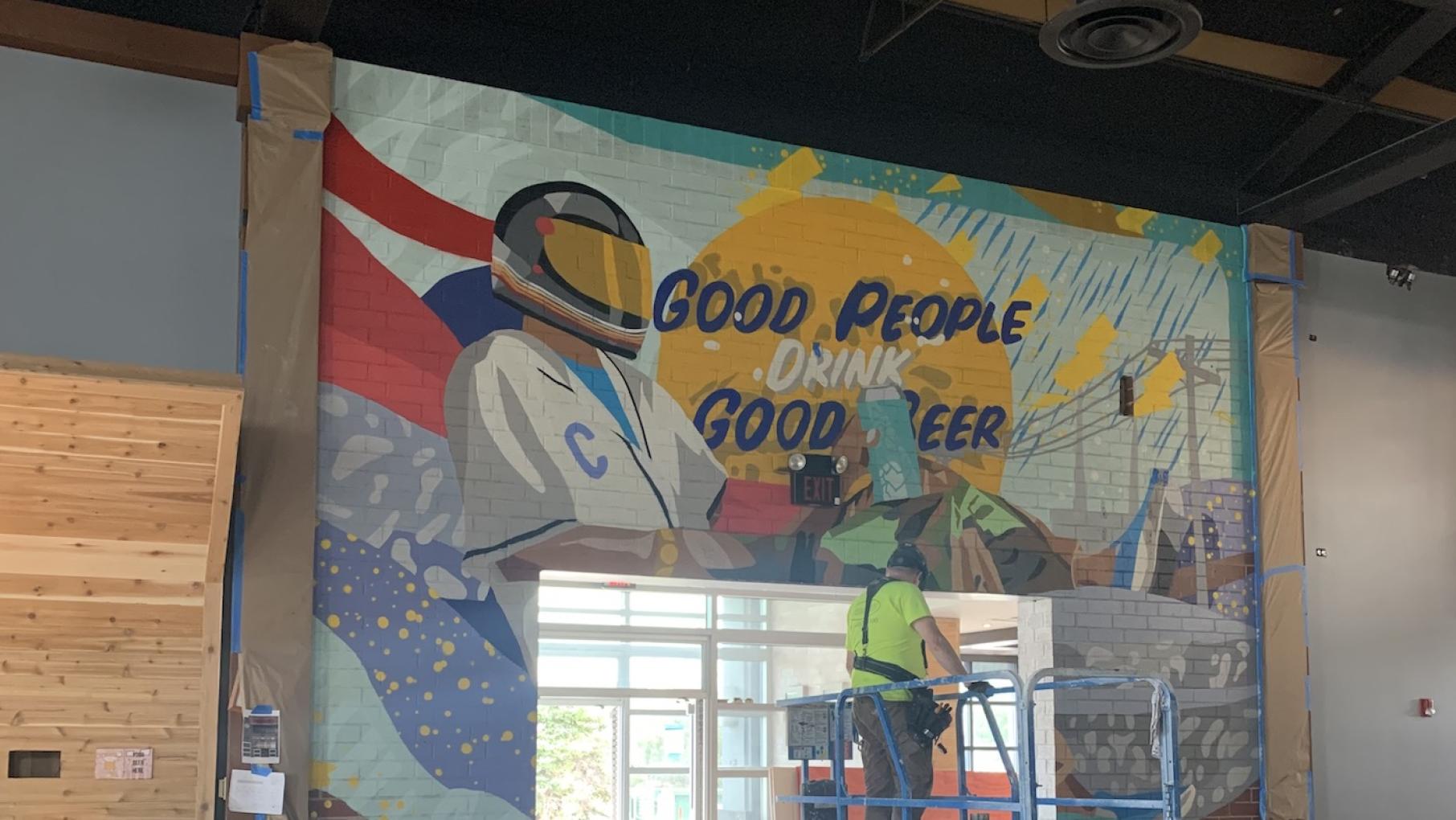 Twisted Hippo Brewing will brew and sell beer in a new Wheeling location of District Brew Yards, due to open in mid-September. Photo: Courtesy District Brew Yards A worker and a mural inside the Wheeling District Brew Yards. Photo: Courtesy District Brew Yards