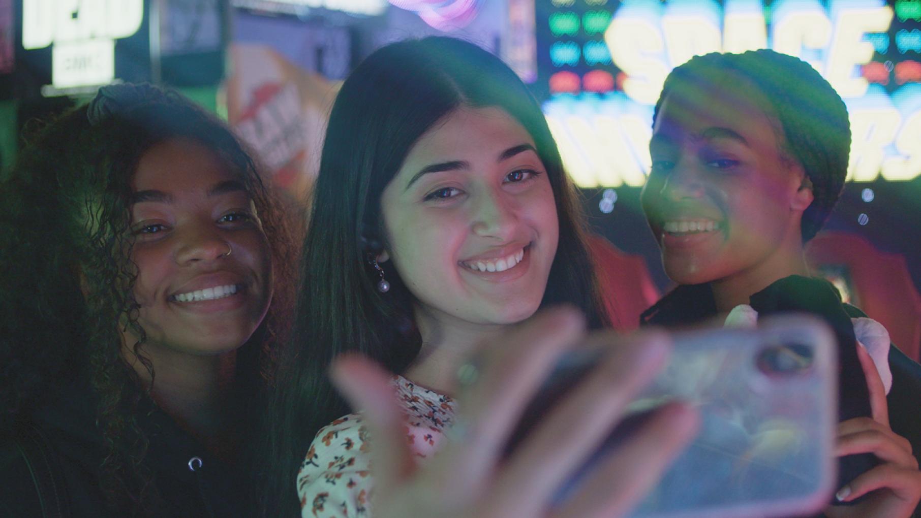 TikTok Influencer Feroza Aziz takes a selfie with her friends in an arcade. Image: Shane Sigler TikTok Influencer Feroza Aziz taking selfie with her friends in an arcade. Image: Shane Sigler