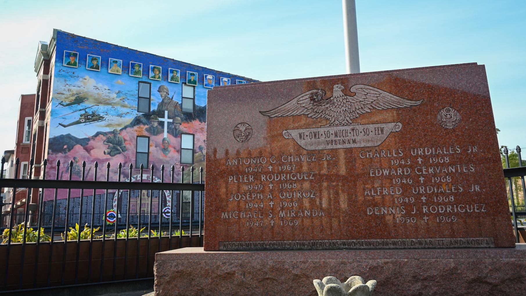 A memorial commemorating 12 fallen Vietnam soldiers sits across the street from Our Lady of Guadalupe Catholic Church in South Chicago. Image: Miguel Zuno, Zuno Photography / WTTW A memorial commemorating 12 fallen Vietnam soldiers sits across the street from Our Lady of Guadalupe Catholic Church in South Chicago. Image: Miguel Zuno, Zuno Photography / WTTW