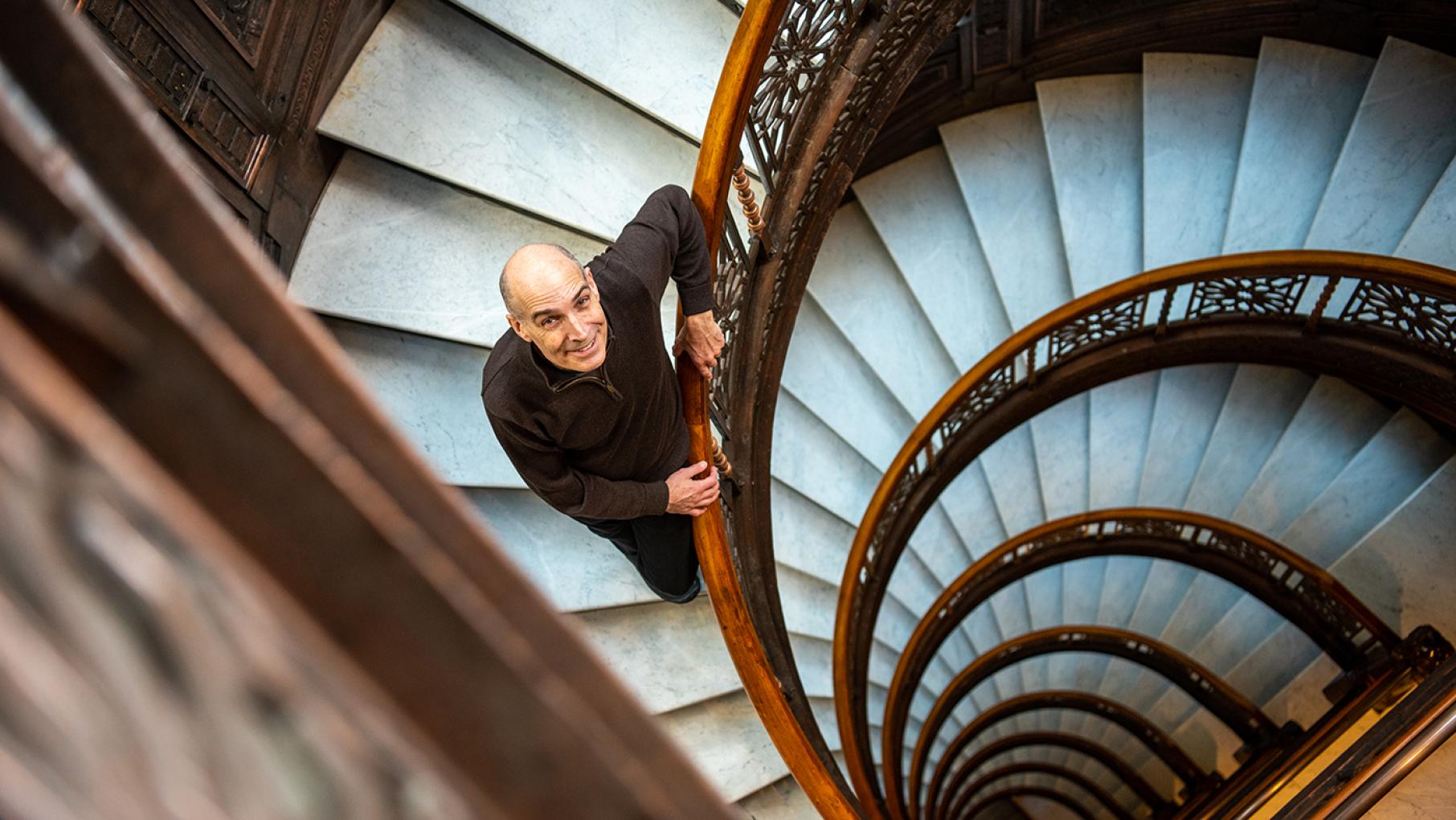 "In every show that I embark on, I come across a handful of just amazingly beautiful places," like the Rookery Building, says Geoffrey Baer. Photo: WTTW/Liz Markel Geoffrey Baer in the Rookery in Chicago
