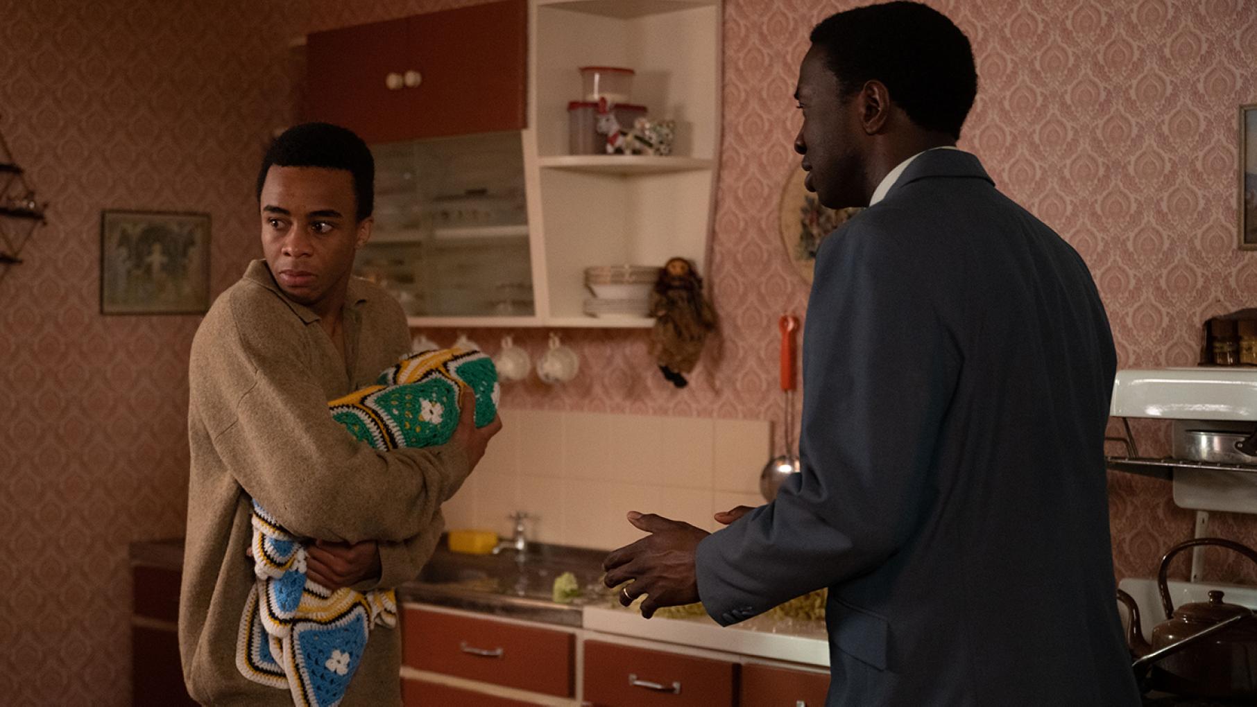Cyril is asked to intervene when a new father starts to act odd. Photo: BBC / Neal Street Productions / Olly Courtney Spencer Wray clutches his baby as Cyril talks to him in a kitchen in Call the Midwife